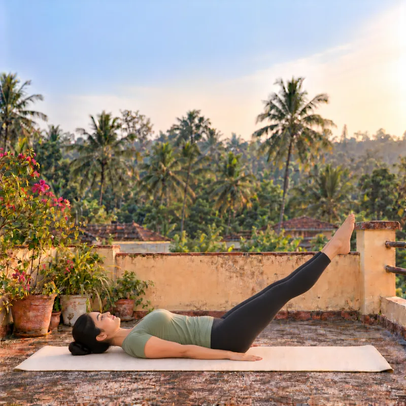 Woman demonstrating Uttānapādāsana, raised legs pose